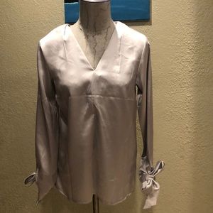 Metallic Silver, long sleeve top. Bow cuffs